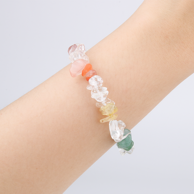 Rainbow chip crystal bracelet with raw-shaped clear quartz, strawberry rose quartz, red agate, citrine, aventurine, aquamarine, and amethyst in a minimalist design