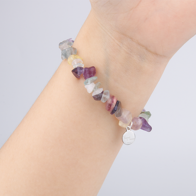 Minimalist chip crystal bracelet with raw-shaped fluorite, featuring multicolored hues and balancing crystal energy