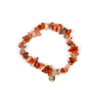 Minimalist chip crystal bracelet with raw-shaped red agate, featuring deep earthy tones and grounding crystal energy