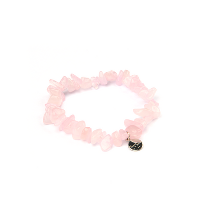 Minimalist chip crystal bracelet with raw-shaped rose quartz, showcasing soft pink hues and a gentle, romantic crystal vibe