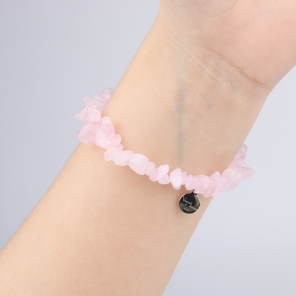 Minimalist chip crystal bracelet with raw-shaped rose quartz, showcasing soft pink hues and a gentle, romantic crystal vibe