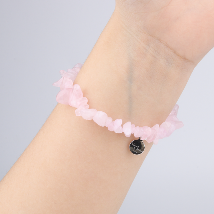Minimalist chip crystal bracelet with raw-shaped rose quartz, showcasing soft pink hues and a gentle, romantic crystal vibe