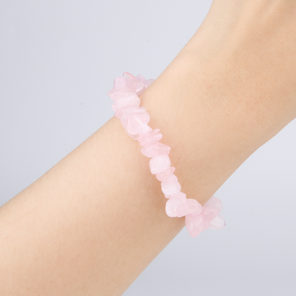 Minimalist chip crystal bracelet with raw-shaped rose quartz, showcasing soft pink hues and a gentle, romantic crystal vibe
