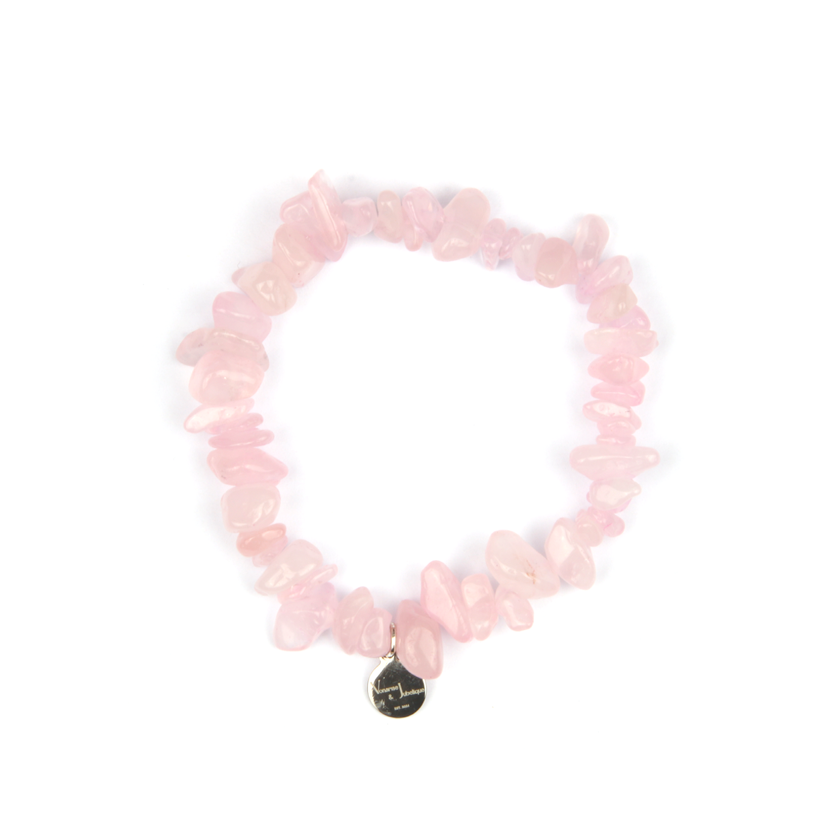 Minimalist chip crystal bracelet with raw-shaped rose quartz, showcasing soft pink hues and a gentle, romantic crystal vibe