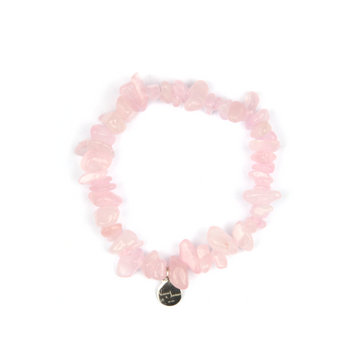 Minimalist chip crystal bracelet with raw-shaped rose quartz, showcasing soft pink hues and a gentle, romantic crystal vibe