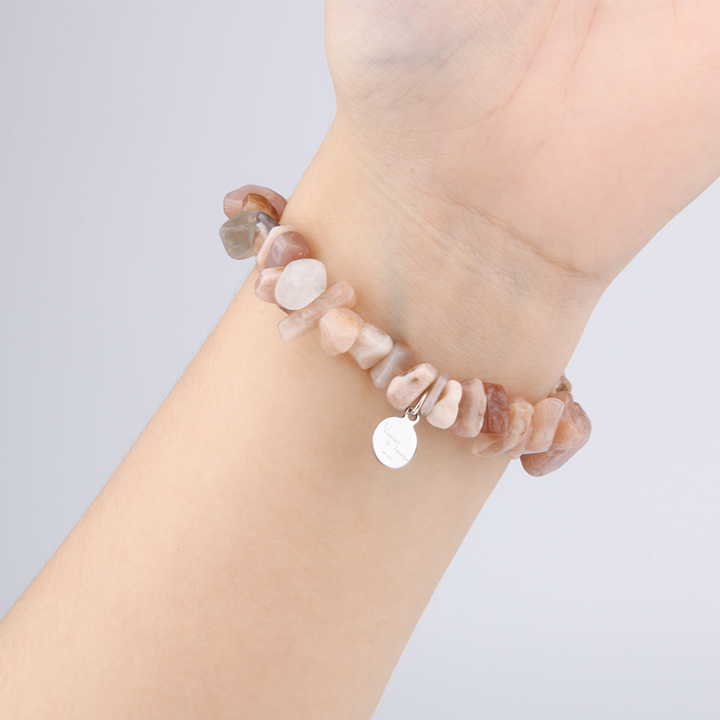 Minimalist chip crystal bracelet with raw-shaped sunstone, radiating warm tones and uplifting crystal energy