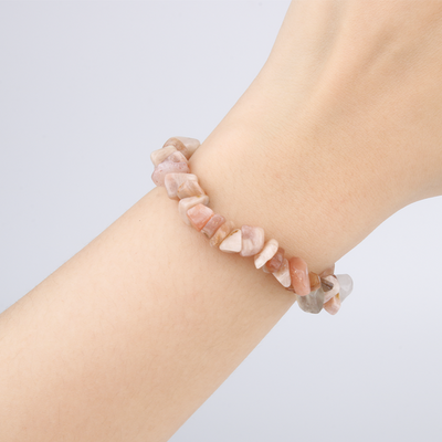 Minimalist chip crystal bracelet with raw-shaped sunstone, radiating warm tones and uplifting crystal energy