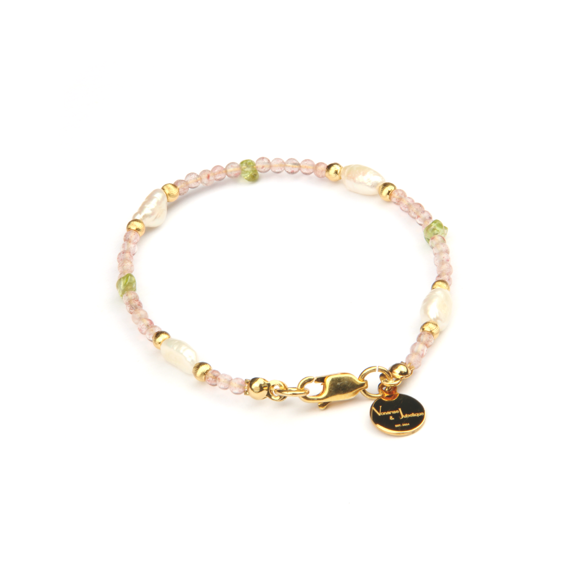 Delicate bracelet featuring blue moonstone, round strawberry rose quartz, and raw-shaped peridot in a minimalist design